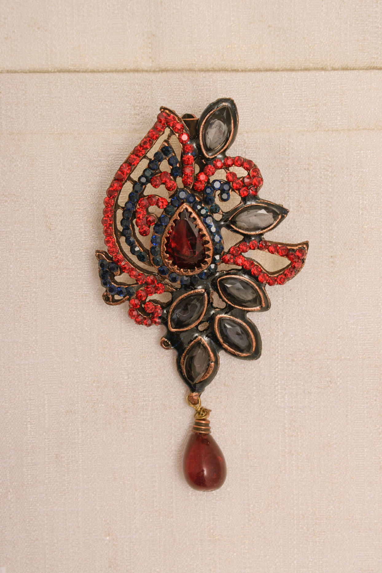 alt message - Manyavar Men Ruby Red Stone Embedded Petal Shaped Brooch image number 1