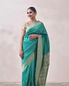 alt message - Mohey Women Rama Green Patterned Saree image number 0