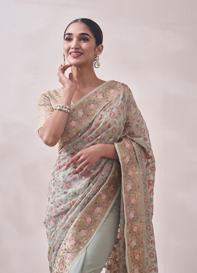 alt message - Mohey Women Light Turquoise Saree with Multicoloured Border image number 0