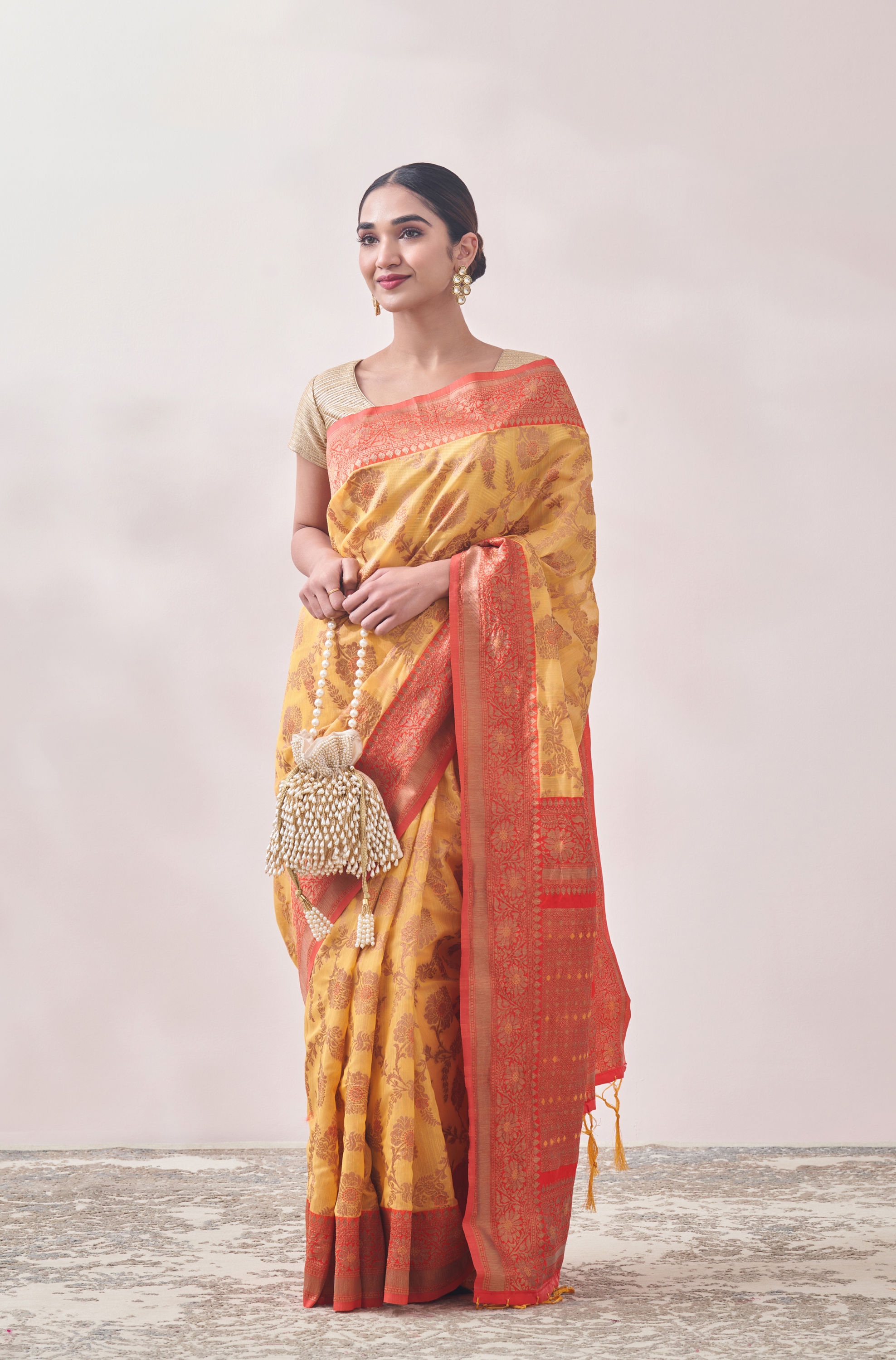 Mohey Women Sunset Yellow Zari Weaved Saree