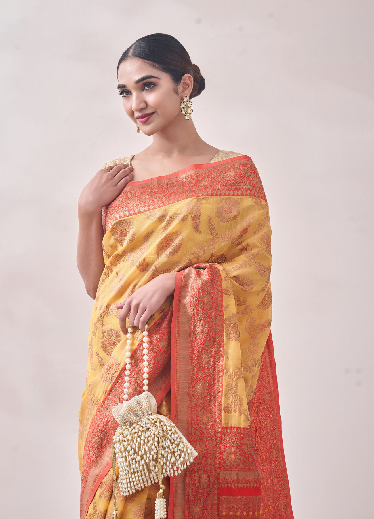 Mohey Women Sunset Yellow Zari Weaved Saree