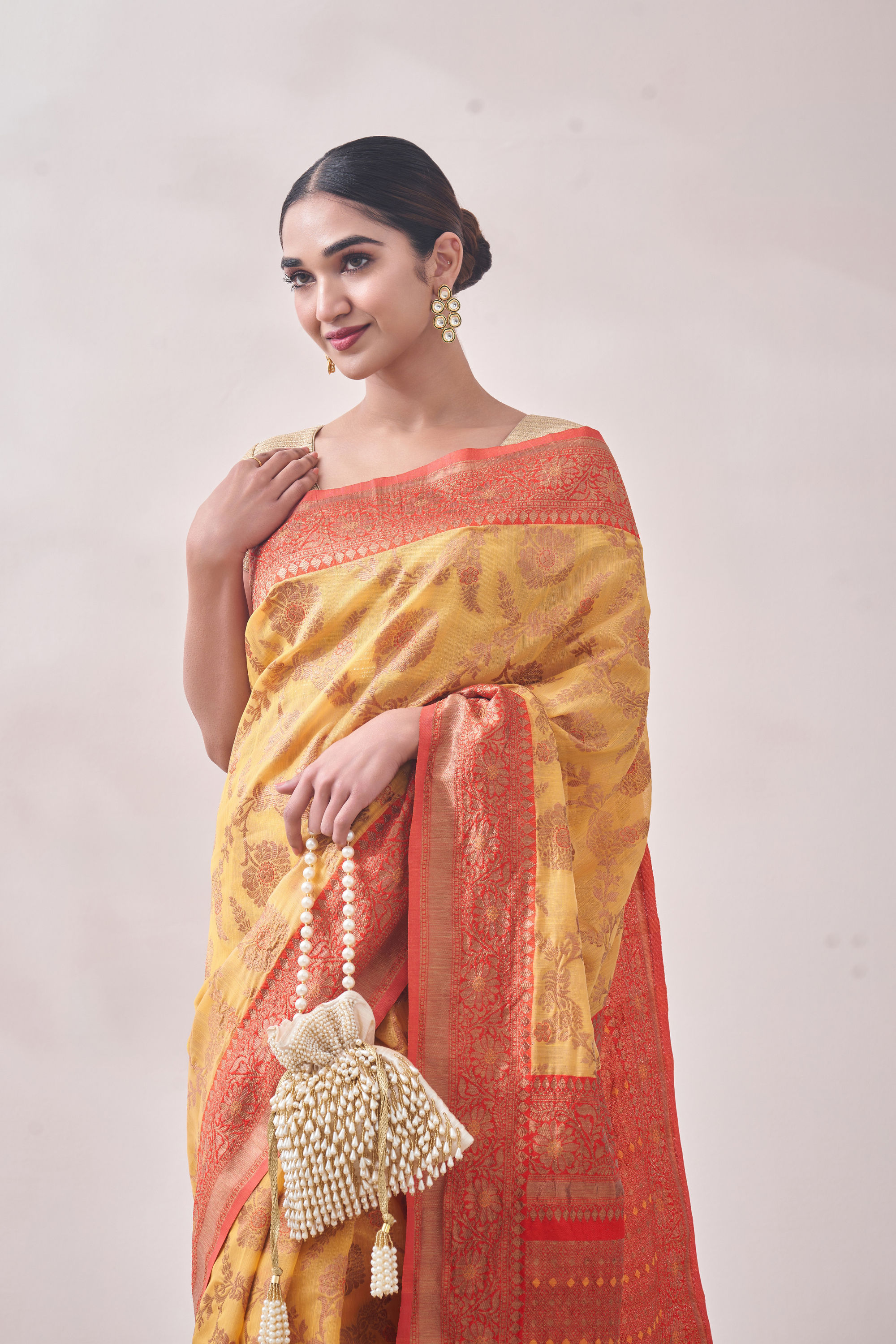 Mohey Women Sunset Yellow Zari Weaved Saree