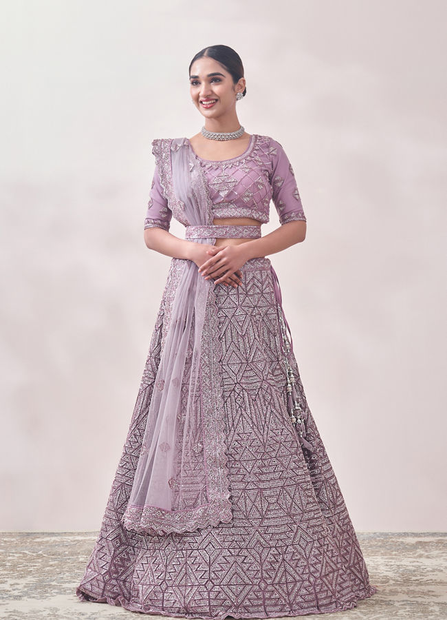 alt message - Mohey Women Mauve Shadow Purple Geometric Patterned Bridal Lehenga image number 0