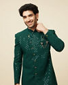 alt message - Manyavar Men Teal Green Harlequin Patterned Angrakha Style Sequined Indo Western Jacket image number 0