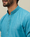 alt message - Manyavar Men Ferozi Blue Embroidered Placket Kurta Set image number 1