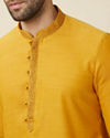 alt message - Manyavar Men Amber Orange Embroidered Bandhgala Kurta Set image number 1