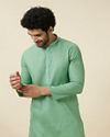 alt message - Manyavar Men Mint Green Embroidered Neckline Kurta Set image number 0