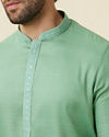 alt message - Manyavar Men Mint Green Embroidered Neckline Kurta Set image number 1