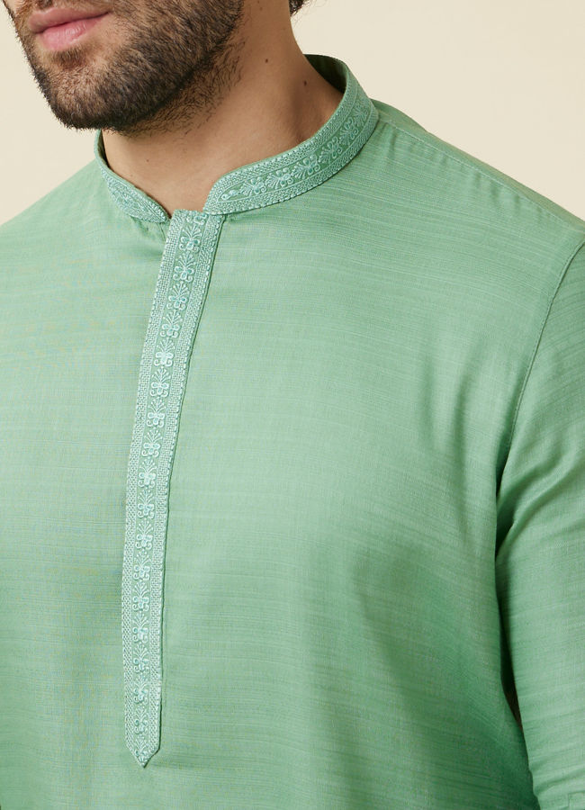 alt message - Manyavar Men Mint Green Embroidered Neckline Kurta Set image number 1