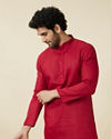 alt message - Manyavar Men True Red Embroidered Neckline Kurta Set image number 0