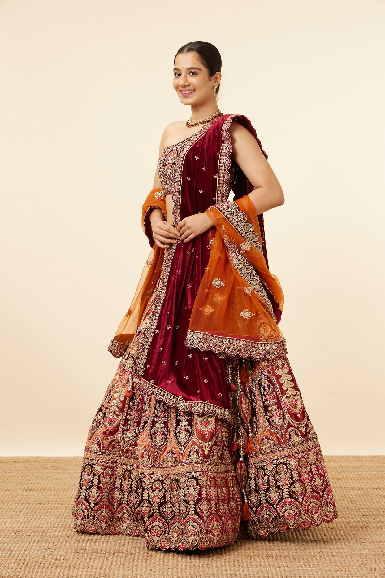 alt message - Mohey Women Orange Maroon Embroidered Bridal Lehenga image number 2