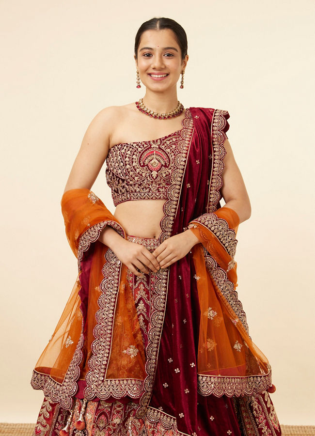 alt message - Mohey Women Orange Maroon Embroidered Bridal Lehenga image number 1