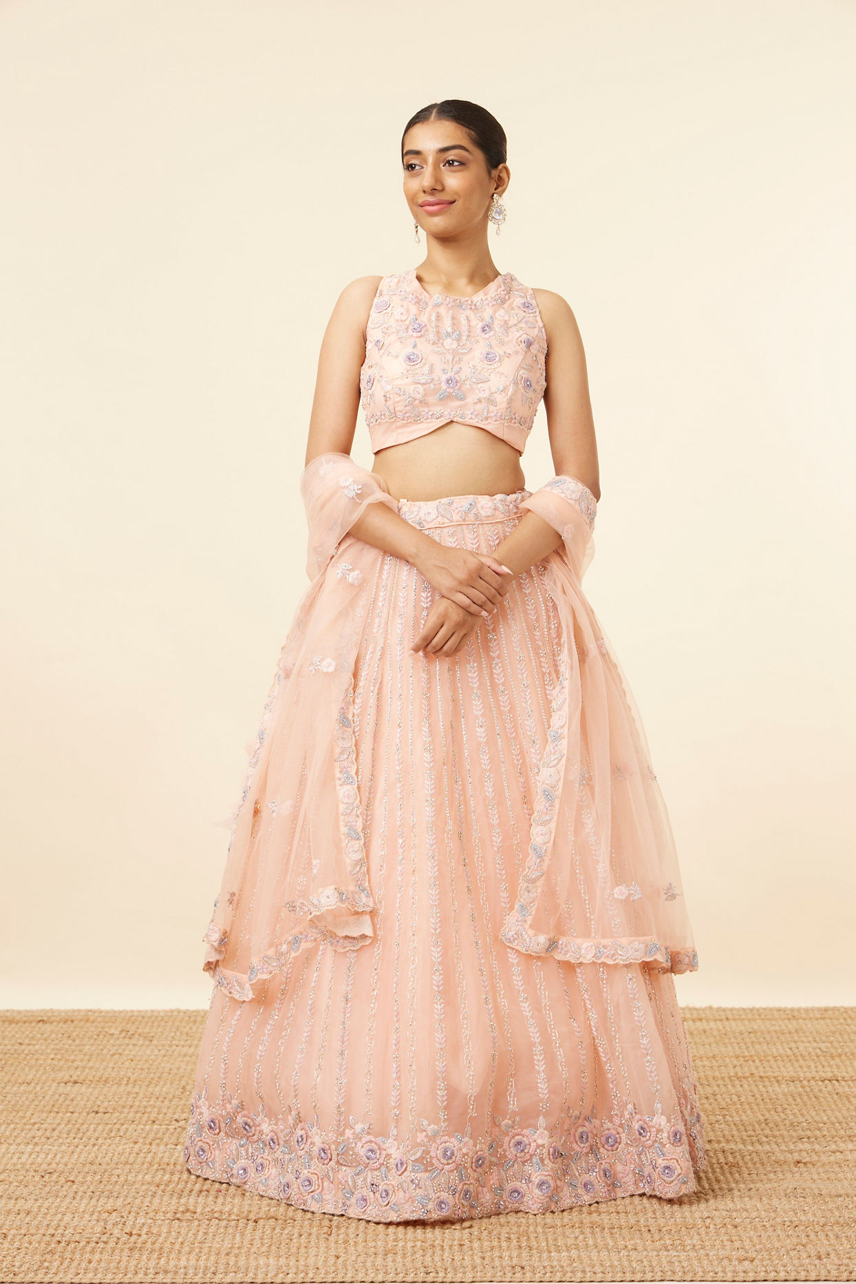 alt message - Mohey Women Peach Pink Net Floral Patterned Lehenga image number 0