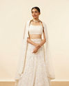 alt message - Mohey Women Light Cream Patterned Lehenga image number 0