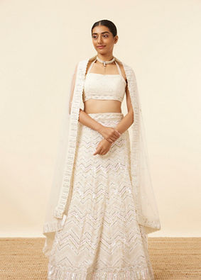 alt message - Mohey Women Light Cream Patterned Lehenga image number 0