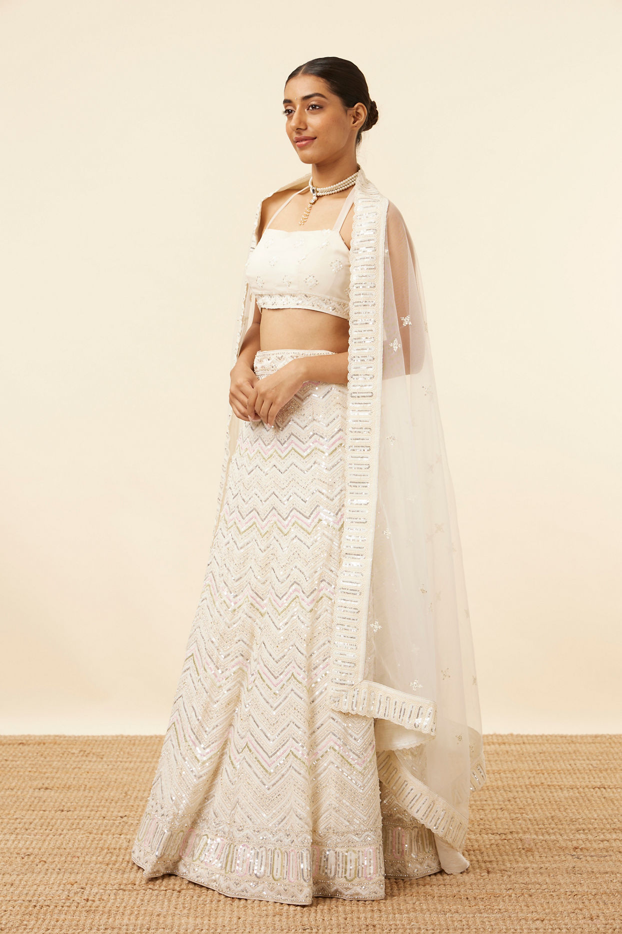 alt message - Mohey Women Light Cream Patterned Lehenga image number 2