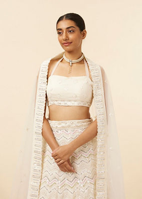 alt message - Mohey Women Light Cream Patterned Lehenga image number 1