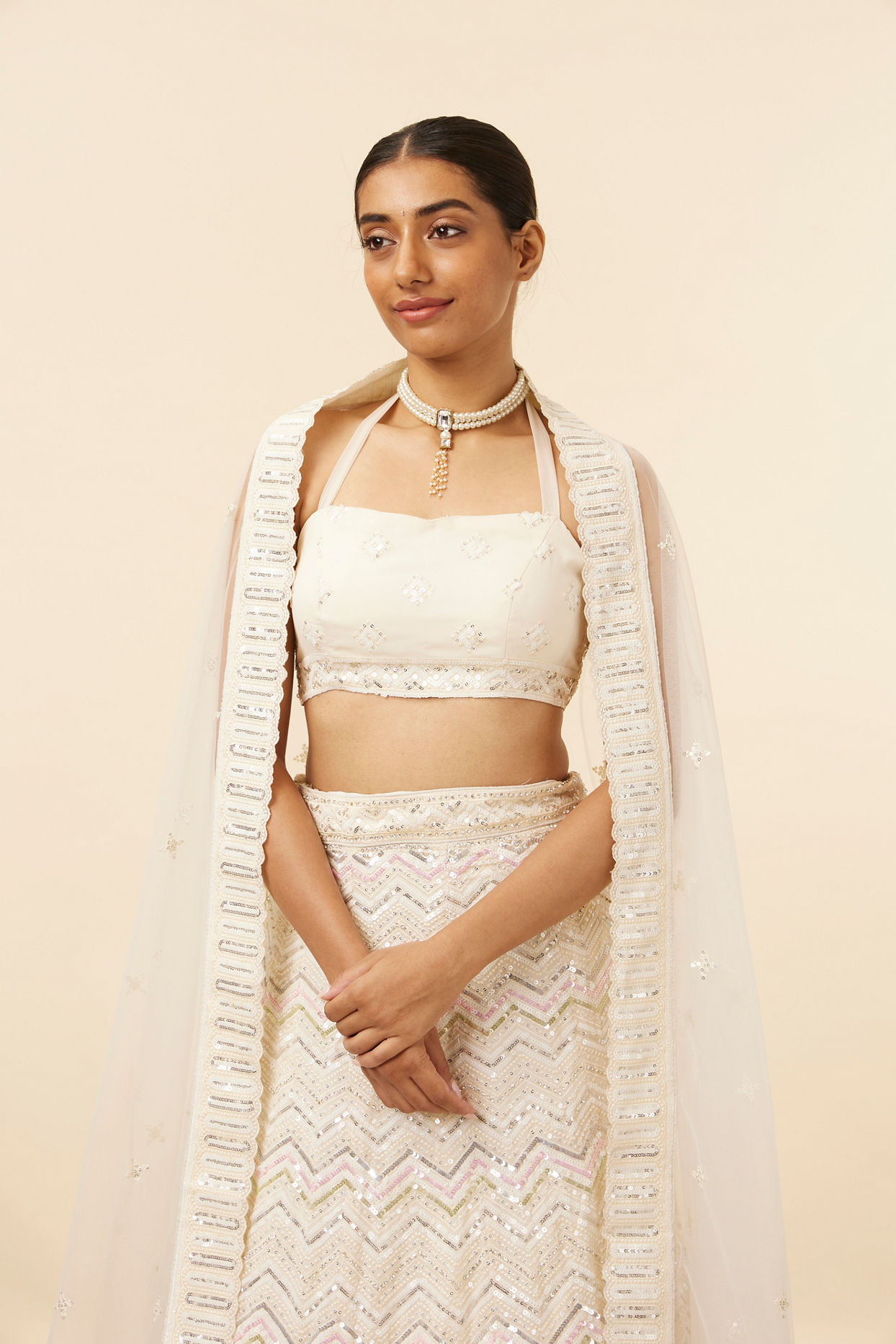 alt message - Mohey Women Light Cream Patterned Lehenga image number 1