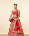 alt message - Mohey Women Red Embellished Bridal Lehenga image number 0