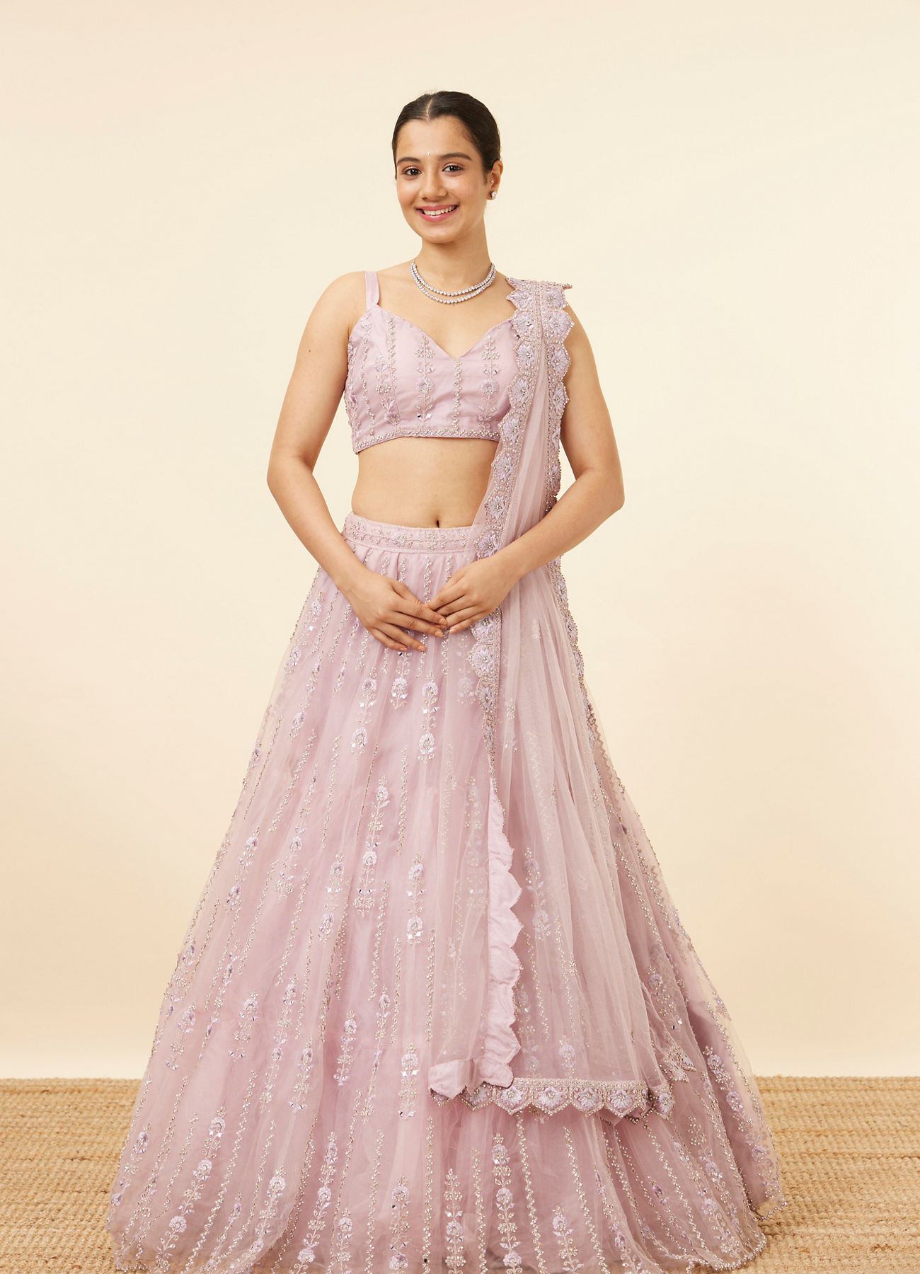 Mohey Women Purple Net Stone Embellished Lehenga