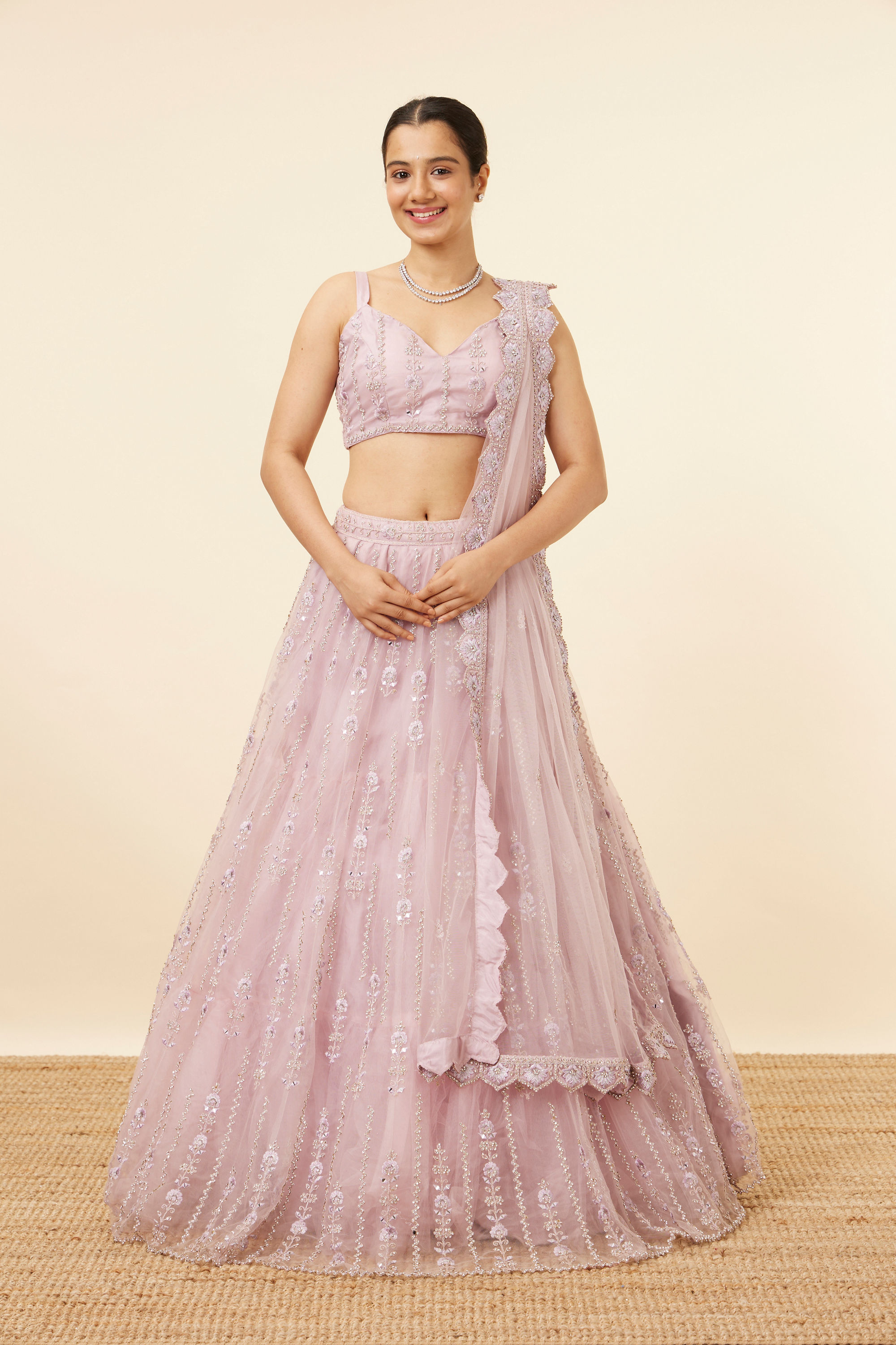 Mohey Women Purple Net Stone Embellished Lehenga