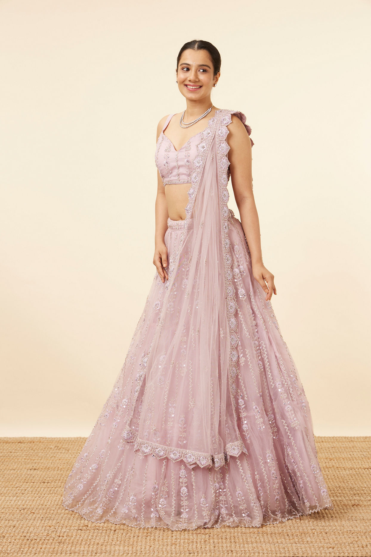 Mohey Women Purple Net Stone Embellished Lehenga