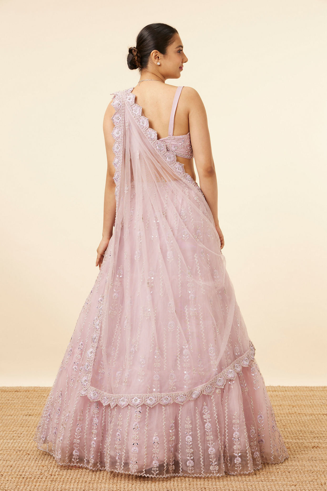 Mohey Women Purple Net Stone Embellished Lehenga