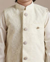 alt message - Manyavar Boys Boys Cream Warm White Self Patterned Jacket Set image number 1