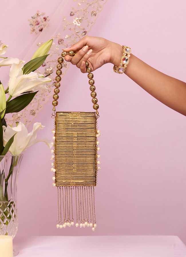 Mohey Women Gleaming Gold Pouch Bag