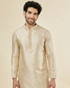 alt message - Manyavar Men Biscuit Cream Shankh Patterned Kurta Set image number 0