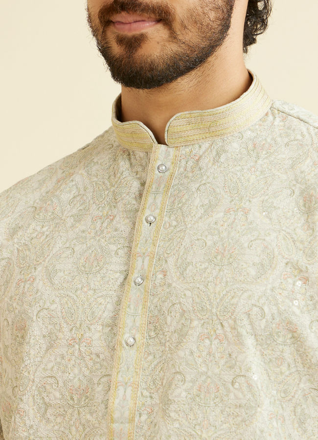 alt message - Manyavar Men Soft Green Chikankari Inspired Floral Buta Print Kurta Set image number 1