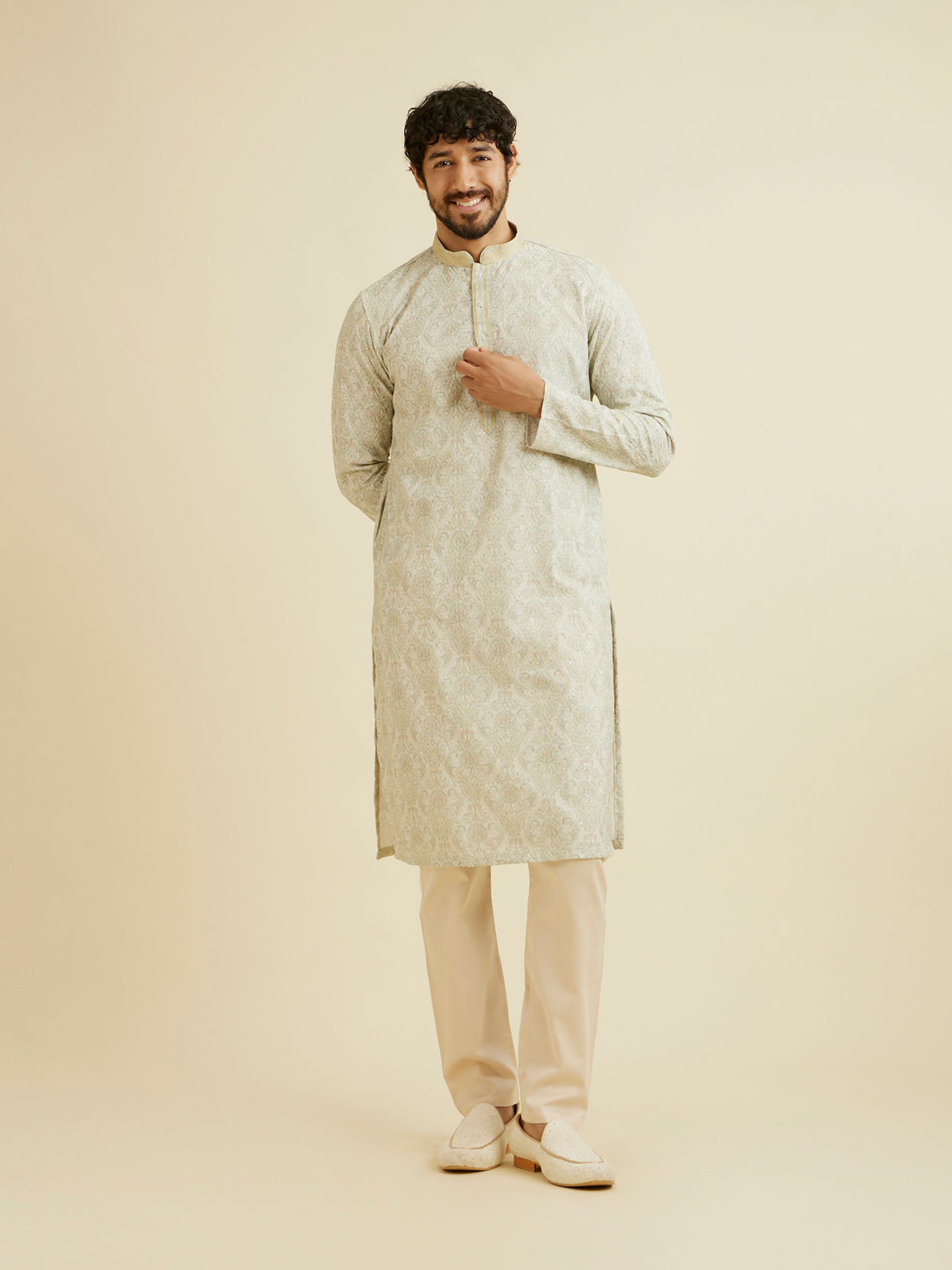 alt message - Manyavar Men Soft Green Chikankari Inspired Floral Buta Print Kurta Set image number 2