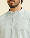 alt message - Manyavar Men Aqua Green Chikankari Inspired Floral Buta Print Kurta Set image number 1