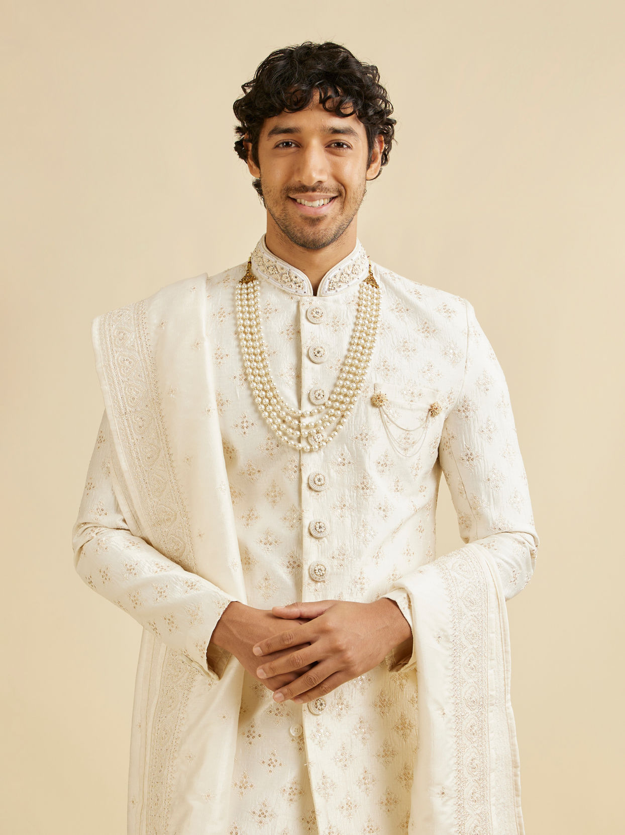 alt message - Manyavar Men Warm White Floral Self Patterned Sherwani Set image number 0