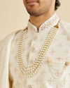 alt message - Manyavar Men Warm White Floral Self Patterned Sherwani Set image number 1