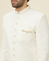 alt message - Manyavar Men Antique White Floral Patterned Sequined Sherwani Set image number 1