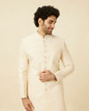 alt message - Manyavar Men Cream Pink Floral and Paisley Patterned Sherwani Set image number 0