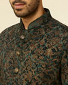 alt message - Manyavar Men Dark green bel Buti Patterned Suit Set image number 1