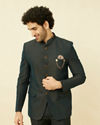 alt message - Manyavar Men Deep Green Lily Motif Jaal Patterned Jodhpuri Suit image number 0