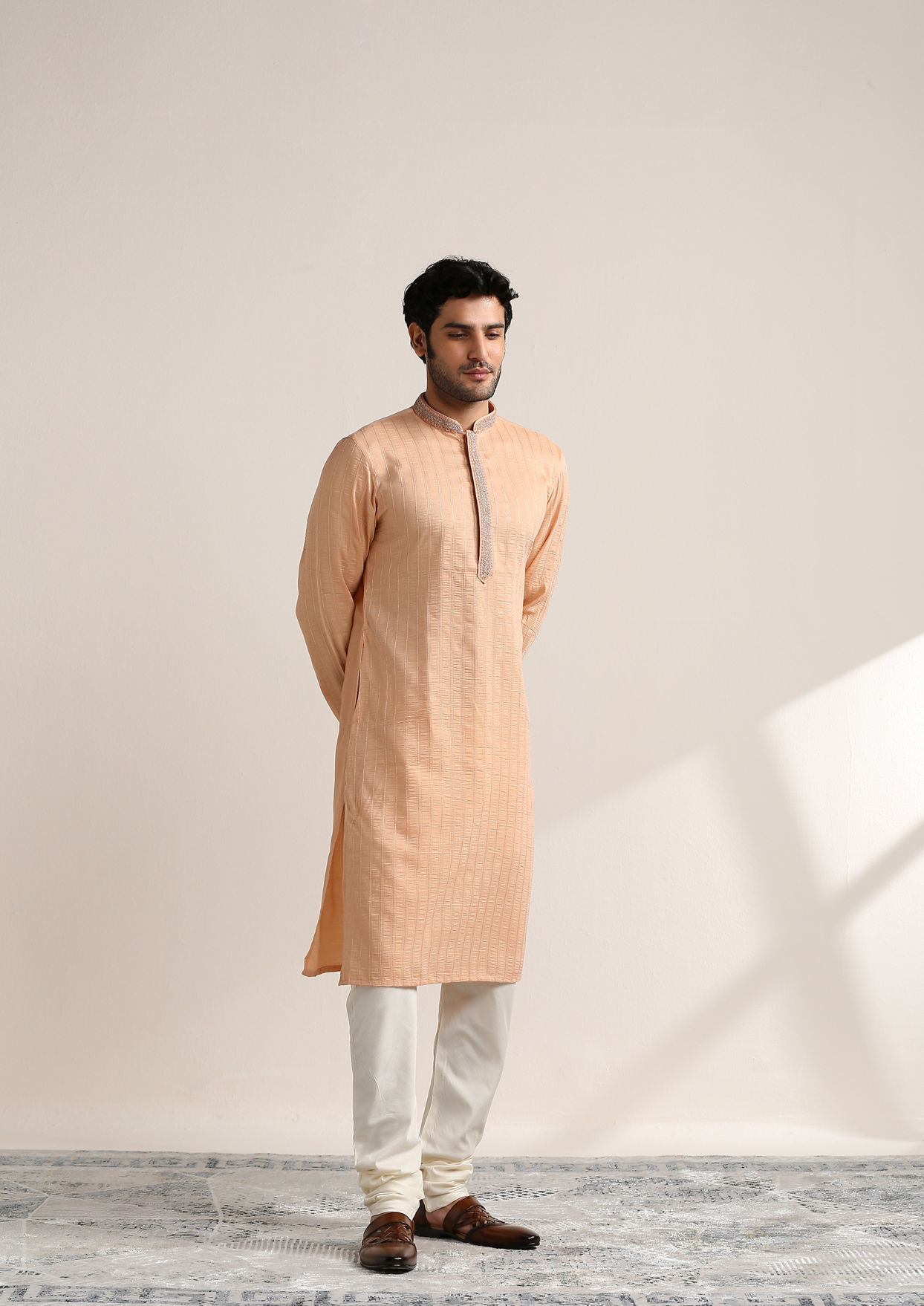 alt message - Twamev Men Peach Nectar Pink Embroidered Neck Kurta Set image number 1