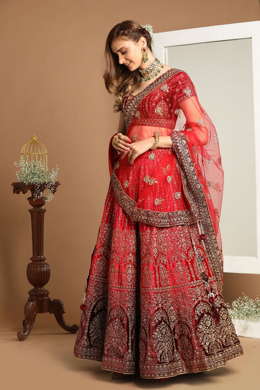 Mohey Women Rani And Maroon Velvet Zari Embroidered Bridal Lehenga