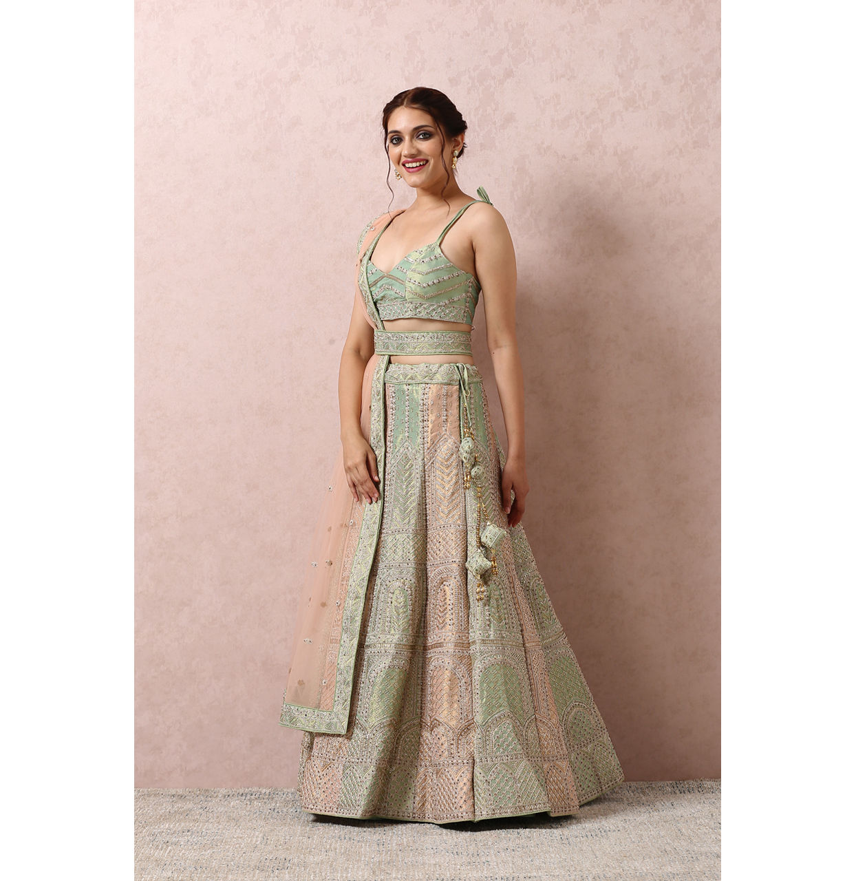 alt message - Mohey Women Pista Embellished Bridal Lehenga image number 2