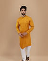 alt message - Manyavar Men Mustard Yellow Self Design Asymmetrical Kurta image number 1