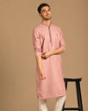 alt message - Manyavar Men Minimalist Pink Kurta Set image number 1