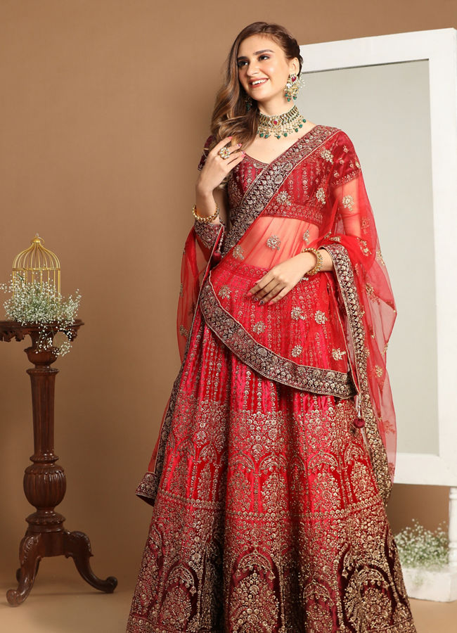 alt message - Mohey Women Rani And Maroon Velvet Zari Embroidered Lehenga image number 0