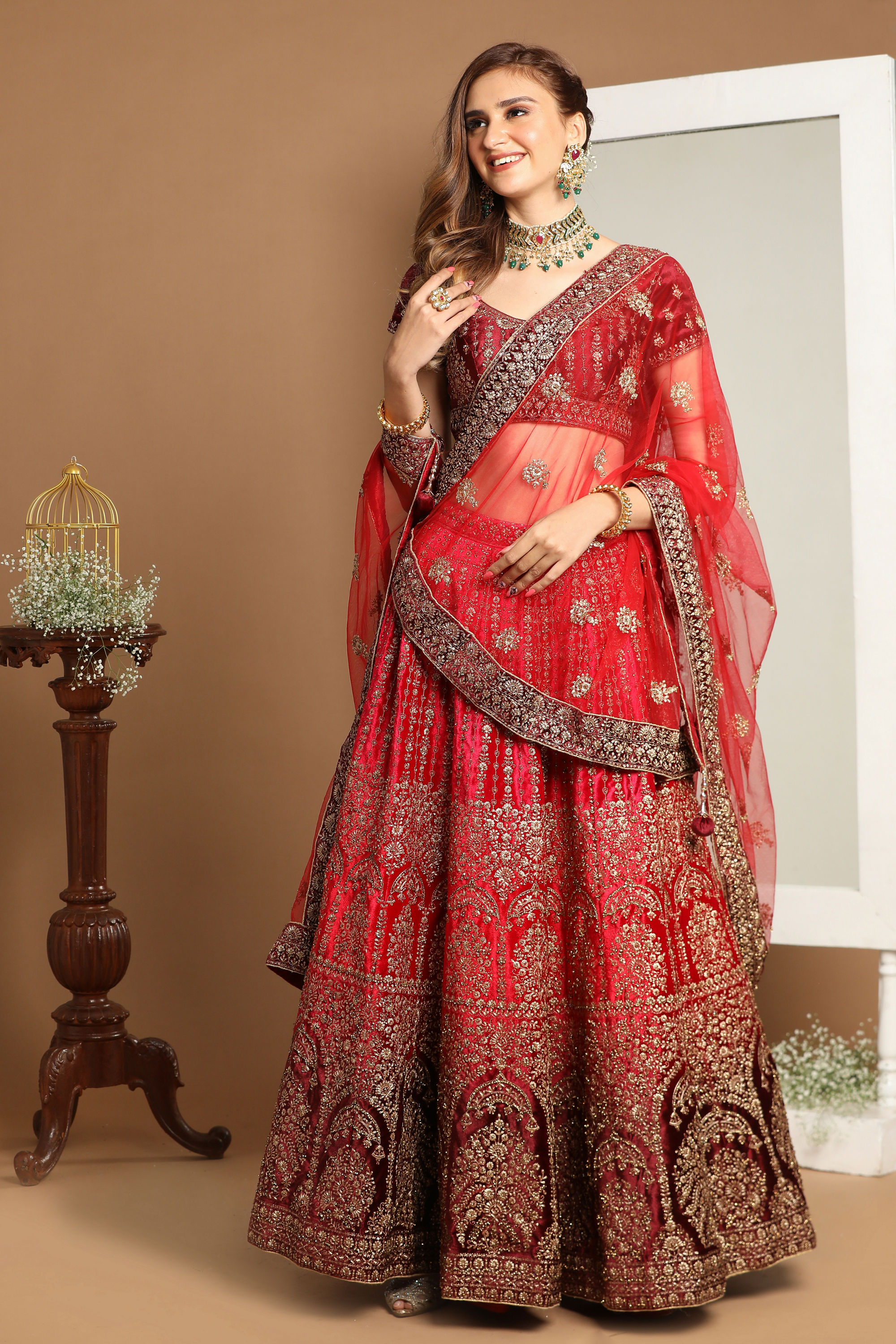 Mohey Women Rani And Maroon Velvet Zari Embroidered Bridal Lehenga