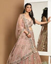 alt message - Mohey Women Embellished Rosy Pink Lehenga image number 0