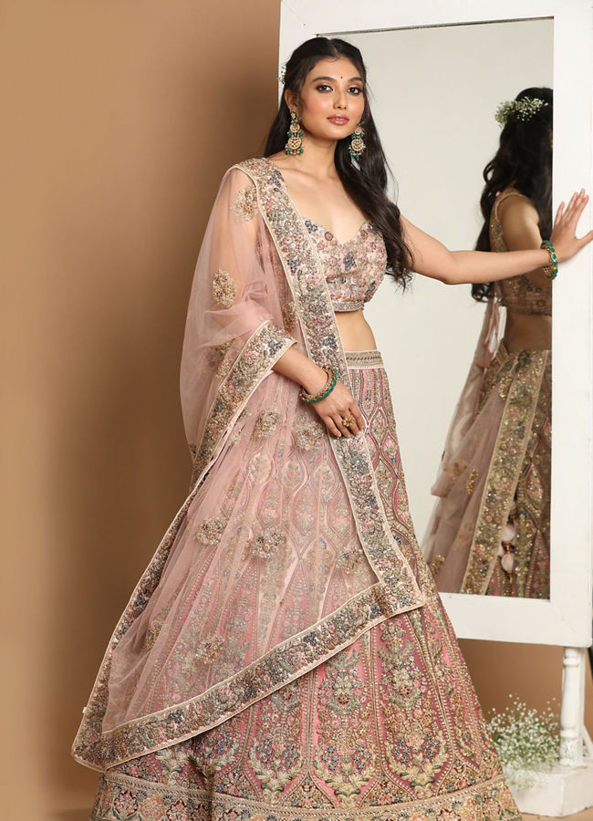 alt message - Mohey Women Embellished Rosy Pink Lehenga image number 0