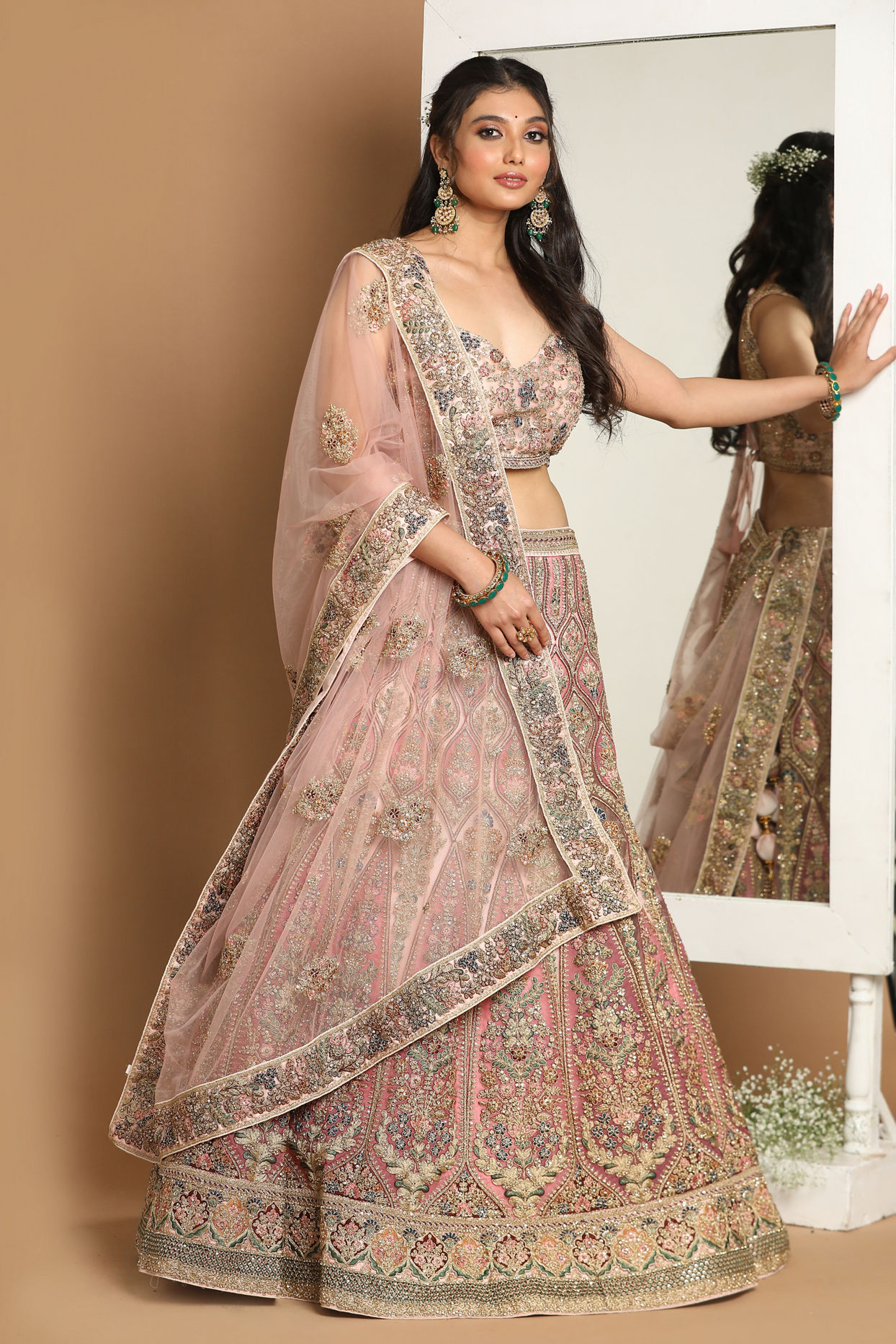 alt message - Mohey Women Embellished Rosy Pink Lehenga image number 0