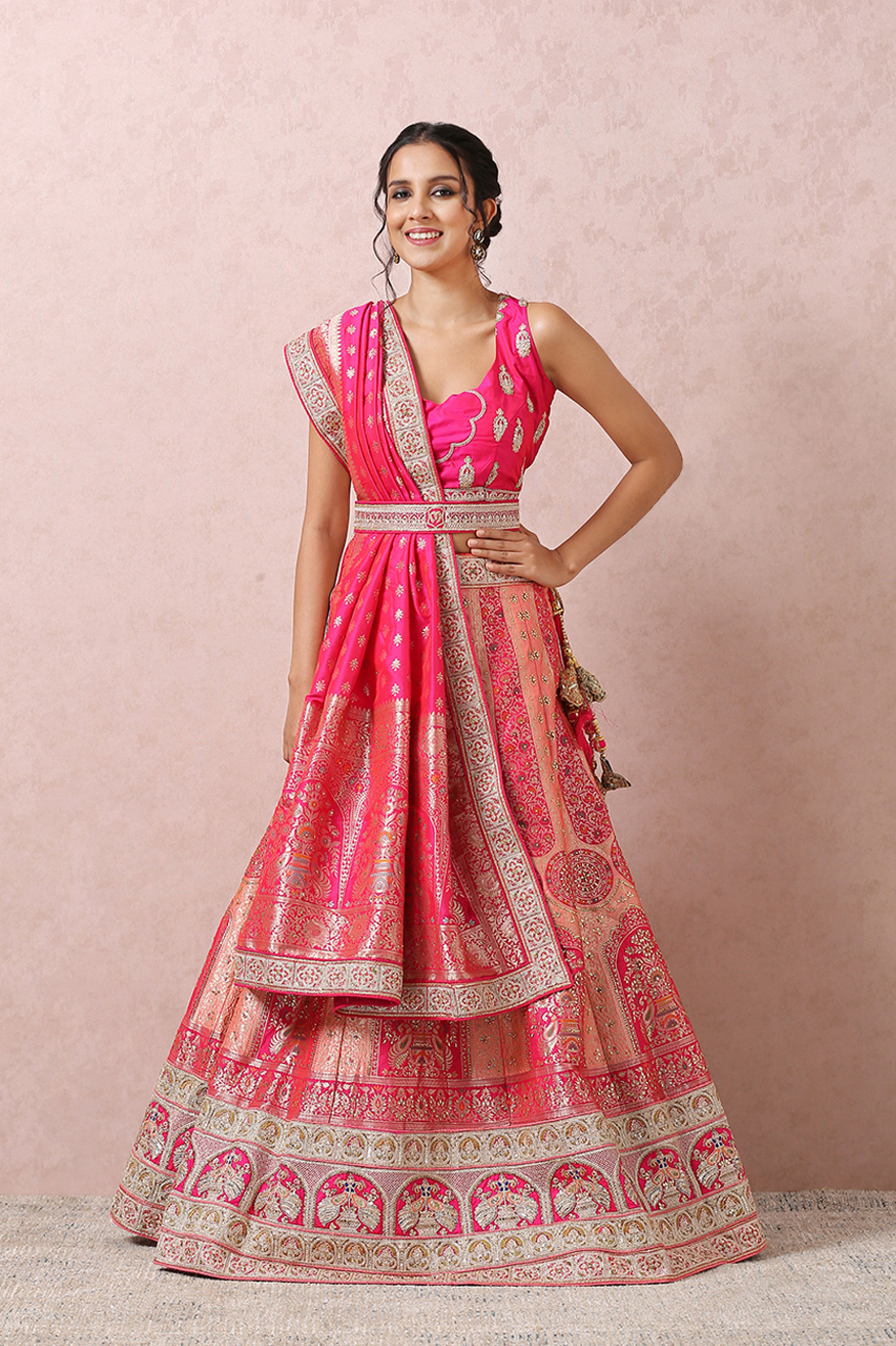 Mohey Women Stone Embellished Pink Benarasi Lehenga